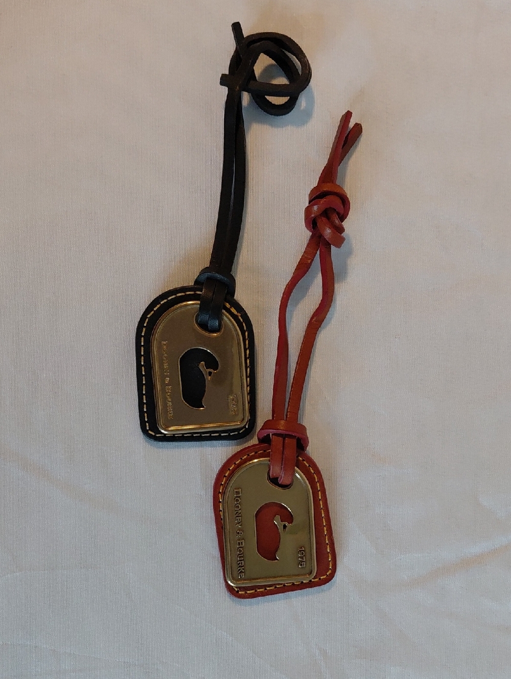 Pair Of Dooney & Bourke Classic Duck Bag Tags
